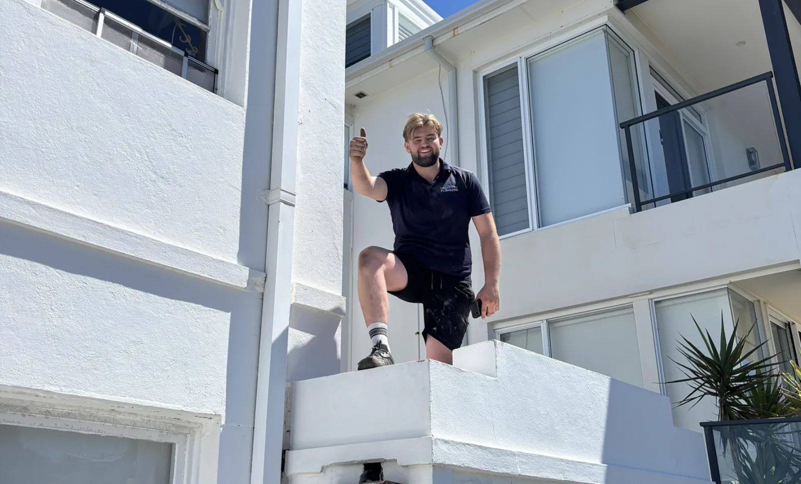 Clearing a blocked balcony drain on a call-out